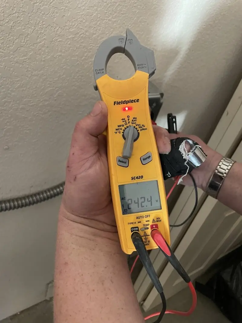 Voltage testing with clamp meter during Outlet Installation in Red Hook